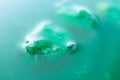 Vibrant green glue slime abstract background with selective focus. Water pollution, environmental protection