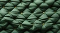 A close up of a green upholstery background