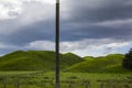 Vibrant Green meadows with sheep grazing in a beautiful New Zealand landscape Royalty Free Stock Photo