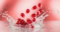 Pomegranate Arils Splashing into Water with Dynamic Splash Royalty Free Stock Photo