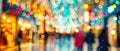 Vibrant Holiday Lights Create A Festive Blur In A Bustling Shopping Mall