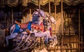 Vibrant horses on a traditional carousel funfair ride in Montmartre, Paris, France Royalty Free Stock Photo