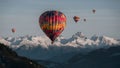 Vibrant hot air balloons soar above majestic mountain peaks