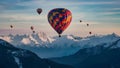 Vibrant hot air balloons soar above majestic mountain peaks