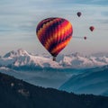 Vibrant hot air balloons soar above majestic mountain peaks