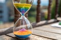 vibrant hourglass with rainbow colored sand flowin - generated by ai Royalty Free Stock Photo