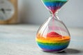 vibrant hourglass with rainbow colored sand flowin - generated by ai Royalty Free Stock Photo