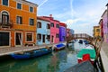 Vibrant houses along a canal in colorful Burano near Venice, Italy