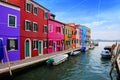 Vibrant houses along a canal in colorful Burano near Venice, Italy Royalty Free Stock Photo