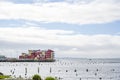 Vibrant housing complex on stilts and a pier at the mouth of the Columbia River Royalty Free Stock Photo