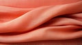 A close up of a peach and red fabric background