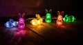 Vibrant Illuminated Bunny String Lights on Wooden Surface in Dark Ambiance. Easter concept