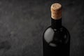 Bottle of Red Wine with Cork on Dark Background Royalty Free Stock Photo