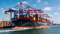 Global Trade Giant: Container Ship Dominating Busy Port Scene Royalty Free Stock Photo