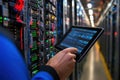 vibrant image of engineers code on tablet in data center Royalty Free Stock Photo