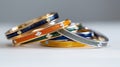 Assorted Colorful Bangles in Gold, Silver, and Enamel on White Background Royalty Free Stock Photo