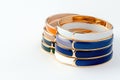Assorted Colorful Bangles in Gold, Silver, and Enamel on White Background Royalty Free Stock Photo