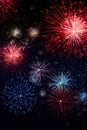 A vibrant image featuring fireworks exploding against a dark night sky. Royalty Free Stock Photo
