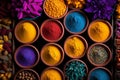 Vibrant indian holi colors and spices on dark rustic background, traditional festival celebration Royalty Free Stock Photo