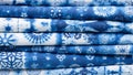 Vibrant indigo batik fabrics with traditional white patterns Royalty Free Stock Photo