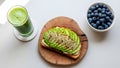 Healthy Breakfast: Avocado Toast, Smoothie, and Blueberries Royalty Free Stock Photo