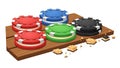 A colorful stack of poker chips on a wooden table with gold coins Royalty Free Stock Photo