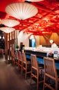 Vibrant Japanese sushi restaurant interior, Chef working at shushi bar