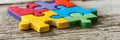 Vibrant jigsaw puzzle assembly symbolizing teamwork and collaboration in a playful manner Royalty Free Stock Photo