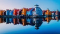 Vibrant landscape of the Netherlands featuring a canal lined with brightly-colored row houses Royalty Free Stock Photo