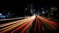 Vibrant light trails streaking through cityscape at night Royalty Free Stock Photo