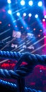 vibrant lights highlight a wrestling ring equipped with three ropes setting the stage for an electrifying performance Royalty Free Stock Photo