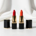 Vibrant lipstick tubes displayed on a sleek white surface Royalty Free Stock Photo
