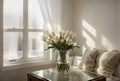 Vibrant and lovely bouquet of white tulips in transparent vase sits on table against background of window in white room.