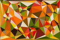 Vibrant low poly abstract background with geometric shapes and dynamic triangle pattern in autumn colors Royalty Free Stock Photo