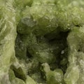 Vibrant Macro Shot of Lustrous Green Mineral Surface with Intricate Details