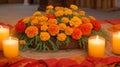 A vibrant marigold-adorned altar with flickering candles