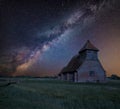 Vibrant Milky Way composite image over landscape of Ancient Medieval church