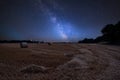 Vibrant Milky Way composite image over landscape of field of hay Royalty Free Stock Photo