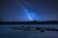 Vibrant Milky Way composite image over landscape of leisure boat Royalty Free Stock Photo