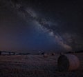 Vibrant Milky Way composite image over landscape of Lovely hay b Royalty Free Stock Photo