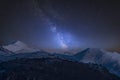 Vibrant Milky Way composite image over landscape of Mount Snowdon and other peaks in Snowdonia National Park