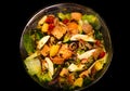 Vibrant Mixed Salad with Chicken, Eggs, and Fresh Vegetables in a Glass Bowl Royalty Free Stock Photo