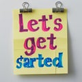 Vibrant Motivational Post-it Note Saying Let's Get Started Royalty Free Stock Photo