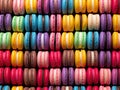 Vibrant multicolor delicious macarons stacked in vertical chromaticity stripes.