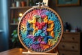 Vibrant multicolor embroidery hoop displaying intricate patterns on wooden stand Royalty Free Stock Photo
