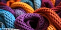 Vibrant multicolored crocheted blankets in a close up view showcasing textures and patterns in a cozy intertwined heap Royalty Free Stock Photo