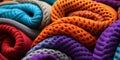 Vibrant multicolored crocheted blankets in a close up view showcasing textures and patterns in a cozy intertwined heap Royalty Free Stock Photo