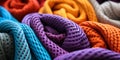 Vibrant multicolored crocheted blankets in a close up view showcasing textures and patterns in a cozy intertwined heap Royalty Free Stock Photo