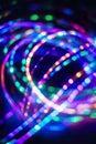 Vibrant multicolored led light strands in abstract spiral pattern Royalty Free Stock Photo