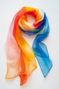 Vibrant Multicolored Silk Scarf on White Background Showcasing Rainbow Gradient Royalty Free Stock Photo